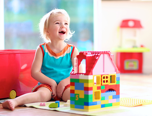 girl playing with Lego